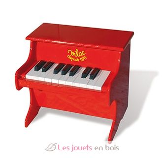 Klavier aus lackiertem rotem Holz. Das Klavier, ein Musikinstrument des